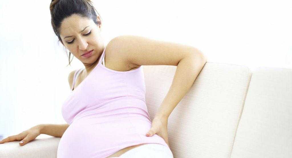 Боли в пояснице при беременности: причины и лечение