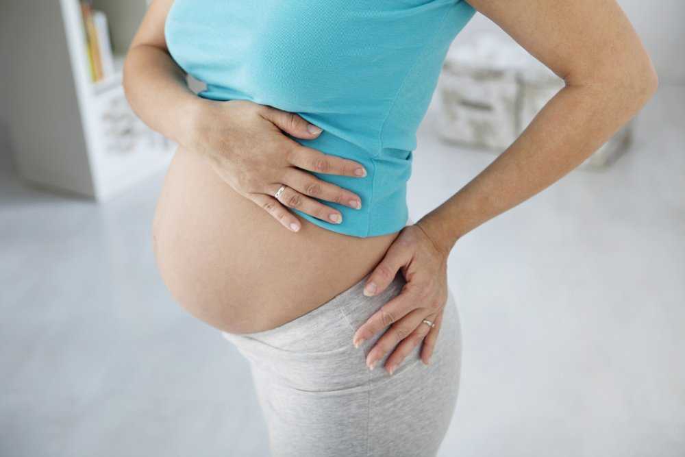 Болит поясница при беременности на ранних сроках